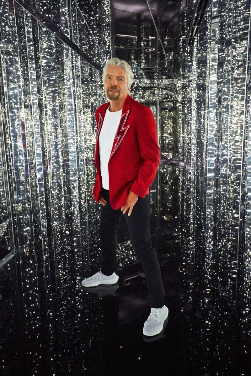 Sir Richard Branson stands in the entrance to the Manor nightclub onboard Scarlet Lady.  Sir Richard Branson Photoshoot
SCL NY Launch Event
Shoot Date: Sept 14, 2021
Usage: Worldwide/universal unlimited rights in perpetuity for all media including 3rd party usage for all footage and images captured during the shoot. Excluding TV + Broadcast.  Description: Portraits of Sir Richard Branson onboard SCL. 
We also photographed CEO Tom McAlpin.  Deliverables: 10 Retouched images  TEAM
Photographer: Peggy Sirota
http://www.peggysirota.com
Agent: Elyse Connolly  CD: Christian Schrader
Art Buyer / Producer: Kathy Boos